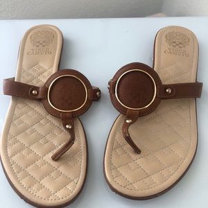 Sandals with gold detail.